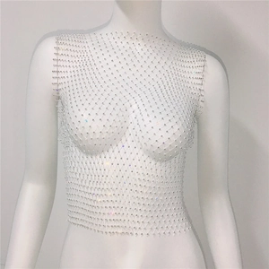 Detailed view of women's sparkling rhinestone fishnet tank top on a mannequin