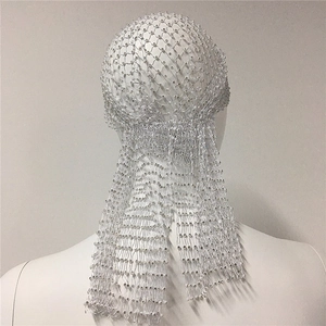 Detail of white mesh headband with rhinestones and long fringe on a model head