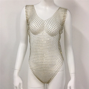 Detailed view of golden rhinestone mesh bodysuit featuring V-neck and diamond weave pattern