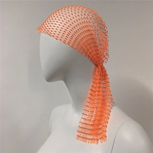 Detailed side view of a vibrant orange rhinestone elastic fishnet headpiece for parties