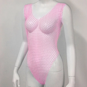 Macro shot of pink rhinestone fishnet mesh fabric on a sleeveless plunging V-neck bodysuit
