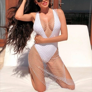 White deep V-neck one-piece swimsuit with shimmering rhinestone fishnet cover-up
