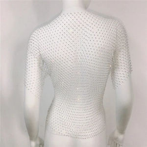Macro view of white mesh top back with sparkling rhinestones for music festivals