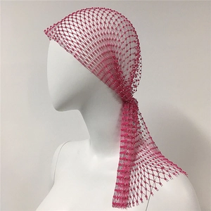 Close-up of hot pink beaded mesh headscarf with shimmering rhinestones and fringes