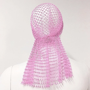 Detailed back view of pink mesh headpiece with sparkling beads and long fringe tassels