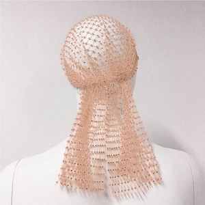 Close-up of pink rhinestone fishnet durag with sparkling crystal details on a mannequin