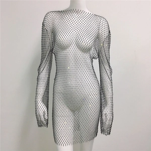 Detailed close-up of a black fishnet dress with sparkling rhinestones on mesh