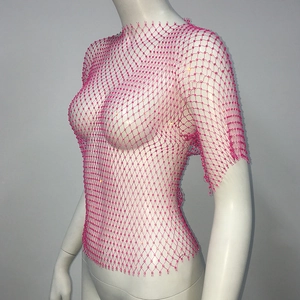 Detail of rose pink rhinestone mesh top featuring large diamond netting and sparkle crystals