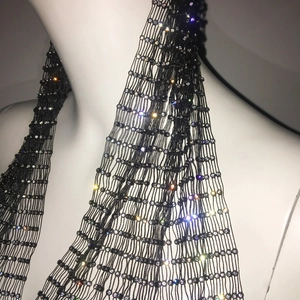 Close-up of elastic fishnet headpiece with sparkling rhinestones for party and rave events