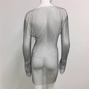 Rear view of black mesh rhinestone dress showing intricate crystal net detail on mannequin