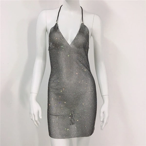 Detailed view of silver mesh rhinestone halter dress with sparkling metallic texture