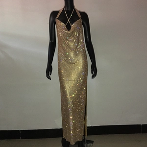 Close-up of gold sequined evening gown featuring deep V-neck and halter cross straps