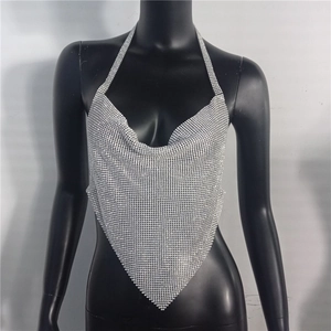 Detail of silver rhinestone halter top with metallic mesh and shimmering crystal draping