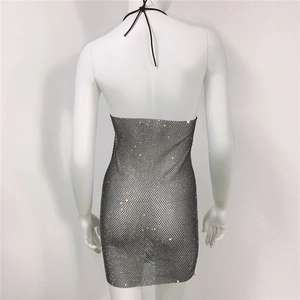 Macro shot of silver metal mesh dress with rhinestones and open back design