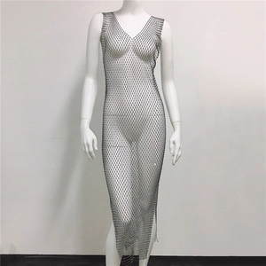 Detail of black fishnet maxi dress with sparkling rhinestones and deep V-neckline