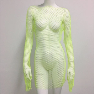Detailed view of neon green rhinestone fishnet dress with sparkling crystal embellishments