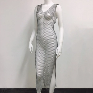 Detail of silver rhinestone fishnet dress featuring a deep V-neck and high side slit