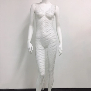 Detailed view of white fishnet mesh maxi dress with sparkling rhinestones and V-neckline