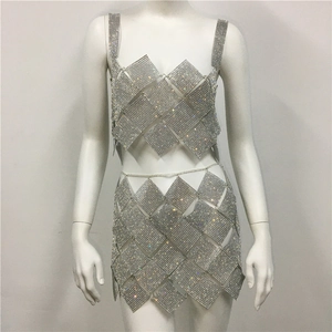 Detailed view of silver sequin patchwork party dress with sparkling rhinestone accents