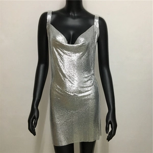 Detail of silver metallic mesh fabric and draped neckline on the sexy sequin party dress