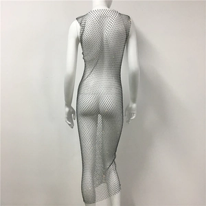 Close-up of black mesh fishnet dress featuring sparkling rhinestone details and镂空 texture