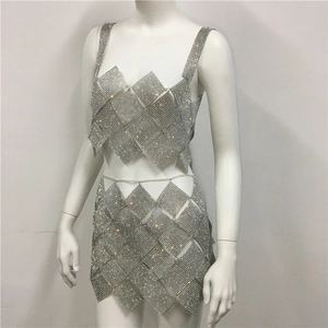Detailed view of silver diamond mesh two-piece set featuring shimmering rhinestone patterns