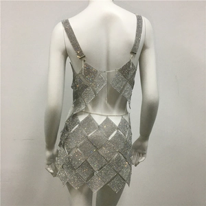 Detailed back view of a silver rhinestone two-piece set with mesh chain and diamond patterns