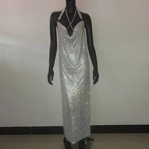 Detail of silver rhinestone halter maxi dress featuring shimmering metallic mesh fabric