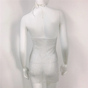 Detail of silver rhinestone mesh dress with lace-up back design on a mannequin