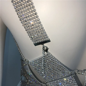 Detail shot of sparkling silver rhinestone body chain with lobster clasp and metal mesh link