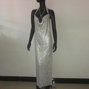 Detail of silver rhinestone mesh halter dress with sparkling metallic sequins and low back