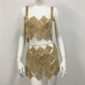 Detail of gold rhinestone mesh two-piece set with diamond-shaped metal sequins