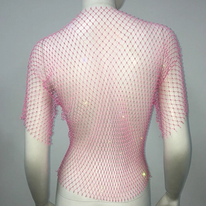 Detail of pink fishnet top with sparkling rhinestones and short sleeves for festivals