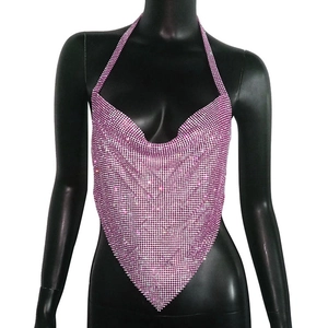 Detail of bright pink metal sequin halter top with deep V-neck and triangular hem design