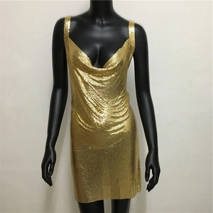 Close-up of golden metal mesh chain dress with cowl neck detail for party wear