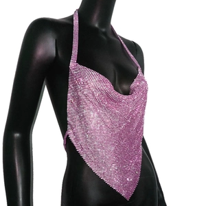 Macro detail of pink rhinestone halter top showing sparkling mesh texture and V-shaped hem