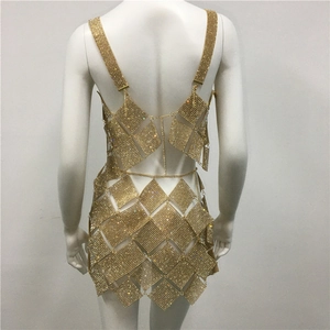 Detail of gold rhinestone mesh two-piece set featuring diamond-shaped link chains