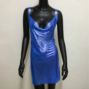 Detailed close-up of shiny royal blue sequin mini dress with draped neckline and metallic mesh
