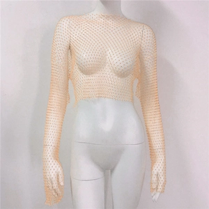 Detail of nude fishnet crop top with rhinestones on a mannequin, frontal view