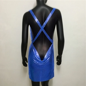 Detail of the open back sequin dress with blue metallic mesh and criss-cross straps