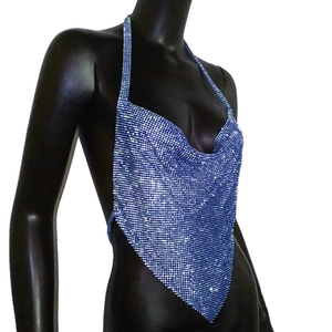 Detail of blue sequined halter top featuring metallic shimmer and cowl neck drape