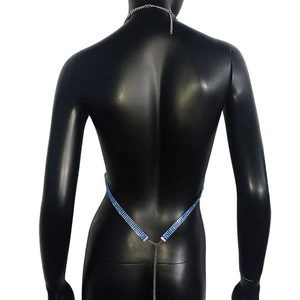 Detail shot of shimmering blue rhinestone body chain with delicate silver metal link chains