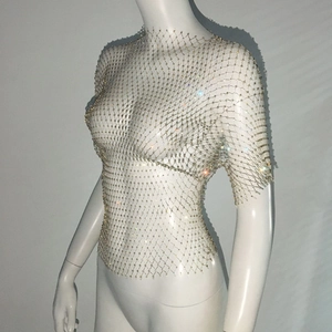 Macro detail of sexy rhinestones on mesh net crop top for music festivals