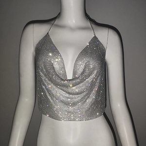 Detailed view of silver sequin metal mesh halter top with deep V-neck and sparkling rhinestones