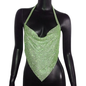 Detailed macro view of the sparkling green rhinestone mesh on the irregular halter top