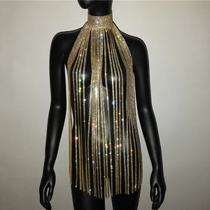 Macro detail of golden rhinestone fringe body chain with sparkling tassel choker design
