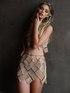 Sparkling gold sequin two-piece set featuring a halter crop top and mini party skirt