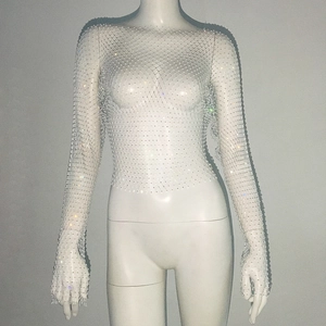 Detail of white mesh top featuring sparkling rhinestones and finger loop sleeve design