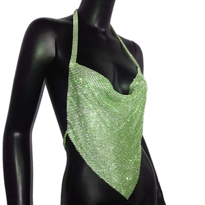 Detail of bright green sequin halter top with deep V-neck and triangular pointed hem
