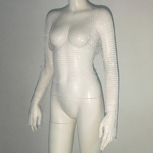 Detail of white mesh long-sleeve top with sparkling rhinestones for party wear
